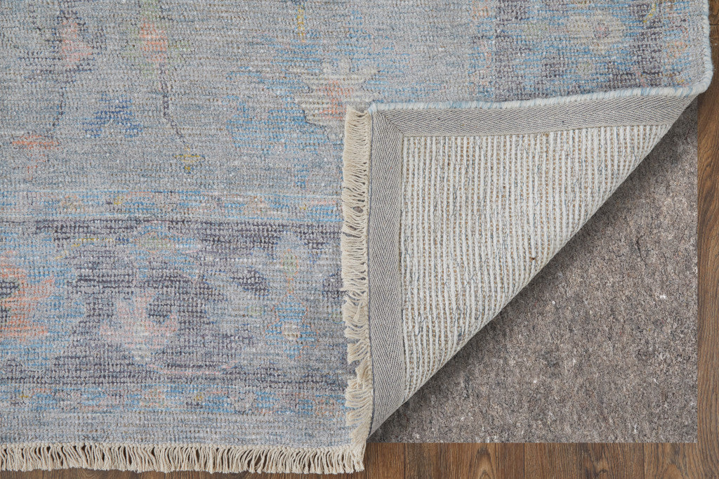 10' X 14' Orange Blue and Gold Floral Hand Woven Distressed Area Rug With Fringe